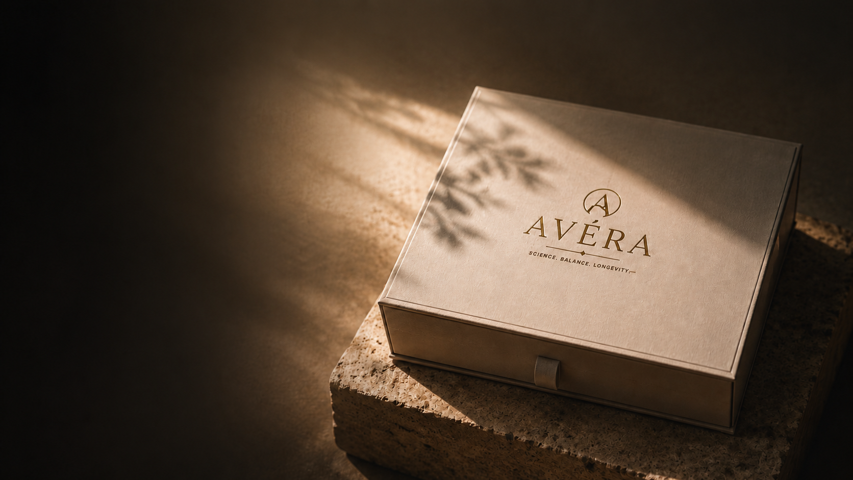 A closed AVÉRA presentation box in a dark cinematic setting